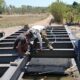 Pembangunan jembatan beton tahap V di Sungai Kanal Pabbundukang, Dusun Pabundukang,